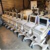 MPI Model DBI-7407 Ultrasound Table w New Creme Upholstery: Power Base and 4 Knockouts Ultrasound Table