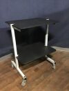 2 Shelf Rolling Equipment AV Cart:  Steel constructed with solid casters, two of them locking.
Meant for heavy items.